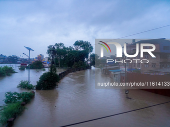 The Bagmati River floods and affects the riverbanks and homes during heavy rainfall in Kathmandu, Nepal, on September 27, 2024. (