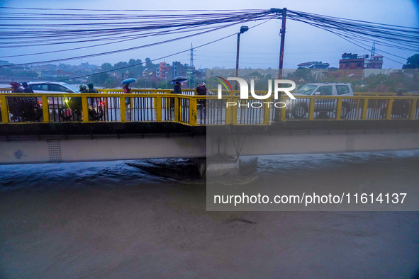 The Bagmati River floods and affects the riverbanks and homes during heavy rainfall in Kathmandu, Nepal, on September 27, 2024. 