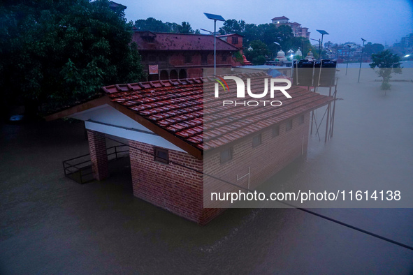 The Bagmati River floods and affects the riverbanks and homes during heavy rainfall in Kathmandu, Nepal, on September 27, 2024. 