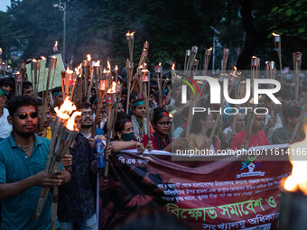 The Hindu community holds demonstrations and torchlight processions to protest the attacks, looting, vandalism, and arson targeting temples...