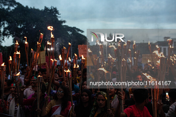 The Hindu community holds demonstrations and torchlight processions to protest the attacks, looting, vandalism, and arson targeting temples...