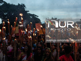 The Hindu community holds demonstrations and torchlight processions to protest the attacks, looting, vandalism, and arson targeting temples...