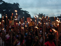 The Hindu community holds demonstrations and torchlight processions to protest the attacks, looting, vandalism, and arson targeting temples...