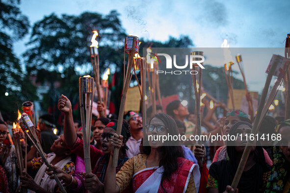 The Hindu community holds demonstrations and torchlight processions to protest the attacks, looting, vandalism, and arson targeting temples...