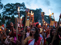 The Hindu community holds demonstrations and torchlight processions to protest the attacks, looting, vandalism, and arson targeting temples...