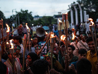 The Hindu community holds demonstrations and torchlight processions to protest the attacks, looting, vandalism, and arson targeting temples...