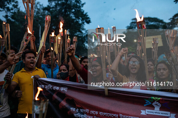 The Hindu community holds demonstrations and torchlight processions to protest the attacks, looting, vandalism, and arson targeting temples...