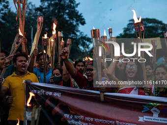 The Hindu community holds demonstrations and torchlight processions to protest the attacks, looting, vandalism, and arson targeting temples...