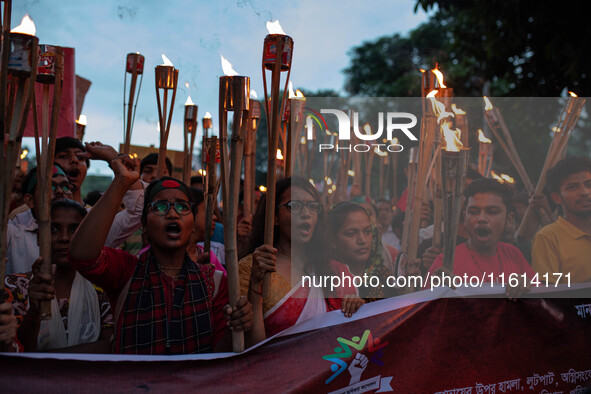 The Hindu community holds demonstrations and torchlight processions to protest the attacks, looting, vandalism, and arson targeting temples...