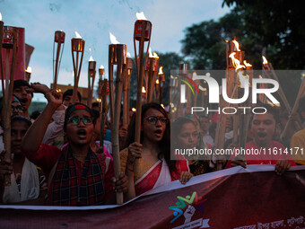 The Hindu community holds demonstrations and torchlight processions to protest the attacks, looting, vandalism, and arson targeting temples...