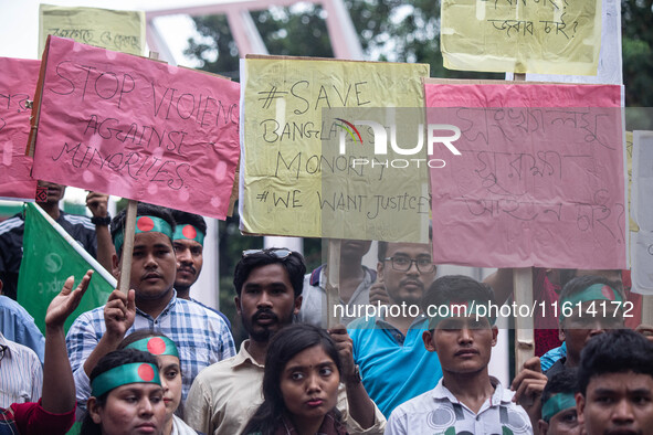 The Hindu community holds demonstrations and torchlight processions to protest the attacks, looting, vandalism, and arson targeting temples...