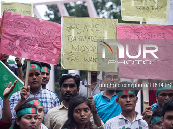 The Hindu community holds demonstrations and torchlight processions to protest the attacks, looting, vandalism, and arson targeting temples...