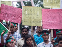 The Hindu community holds demonstrations and torchlight processions to protest the attacks, looting, vandalism, and arson targeting temples...