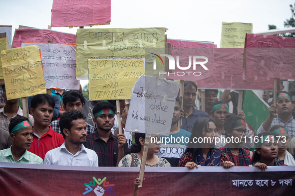 The Hindu community holds demonstrations and torchlight processions to protest the attacks, looting, vandalism, and arson targeting temples...