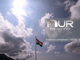 The Indian National Flag (Tri-Color) waves amid winds at the Line of Control in Kupwara, Jammu and Kashmir, India, on September 27, 2024. (