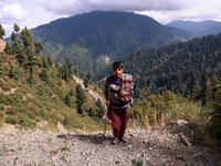 Iqbal, 14, stands with a flock of sheep in Kupwara, Jammu and Kashmir, India, on September 27, 2024. (