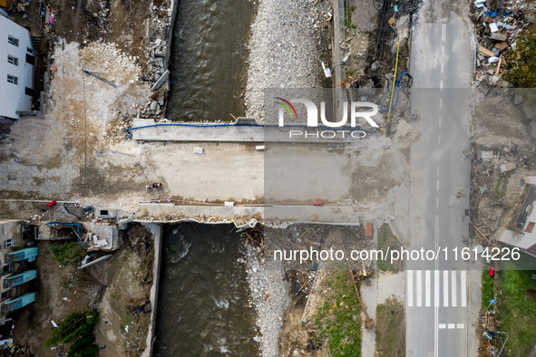 Aerial view of destroyed  buildings and a bridge as massive flooding affected tourist resorts in southern Poland - Ladek Zdroj, Poland on Se...