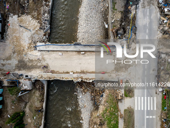 Aerial view of destroyed  buildings and a bridge as massive flooding affected tourist resorts in southern Poland - Ladek Zdroj, Poland on Se...