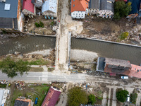 Aerial view of destroyed  buildings and a bridge as massive flooding affected tourist resorts in southern Poland - Ladek Zdroj, Poland on Se...