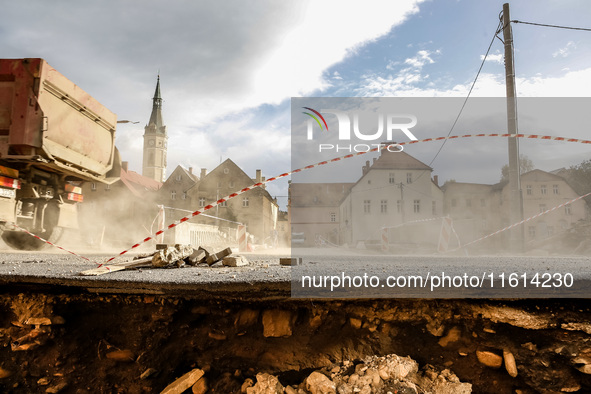 Washed out edge of a road is seen as massive flooding affected tourist resorts in southern Poland - Ladek Zdroj, Poland on September 27, 202...