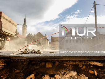 Washed out edge of a road is seen as massive flooding affected tourist resorts in southern Poland - Ladek Zdroj, Poland on September 27, 202...