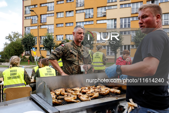 Volunteers prepare food for aid workers and affected citizens as massive flooding affected tourist resorts in southern Poland - Stronie Slas...