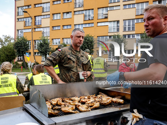 Volunteers prepare food for aid workers and affected citizens as massive flooding affected tourist resorts in southern Poland - Stronie Slas...