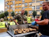 Volunteers prepare food for aid workers and affected citizens as massive flooding affected tourist resorts in southern Poland - Stronie Slas...