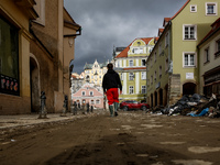 A man walks pass debris from destroyed  buildings as massive flooding affected tourist resorts in southern Poland - Klodzko, Poland on Septe...