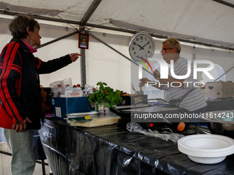 Volunteers prepare food for aid workers and affected citizens as massive flooding affected tourist resorts in southern Poland - Klodzko, Pol...