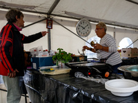 Volunteers prepare food for aid workers and affected citizens as massive flooding affected tourist resorts in southern Poland - Klodzko, Pol...