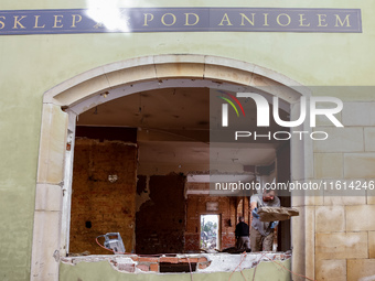 A man warks in destroyed shop as massive flooding affected tourist resorts in southern Poland - Klodzko, Poland on September 27, 2024. Centr...