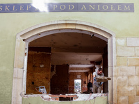 A man warks in destroyed shop as massive flooding affected tourist resorts in southern Poland - Klodzko, Poland on September 27, 2024. Centr...