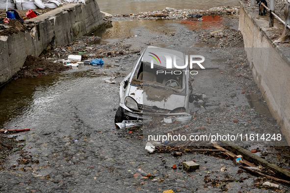 Debris and destroyed car are seen  as massive flooding affected tourist resorts in southern Poland - Klodzko, Poland on September 27, 2024....