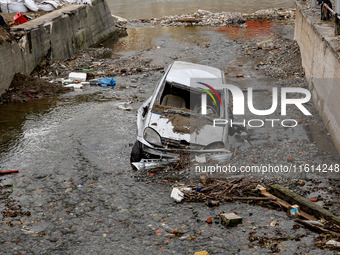 Debris and destroyed car are seen  as massive flooding affected tourist resorts in southern Poland - Klodzko, Poland on September 27, 2024....