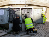 Electritians fix residential building electricity as massive flooding affected tourist resorts in southern Poland - Klodzko, Poland on Septe...