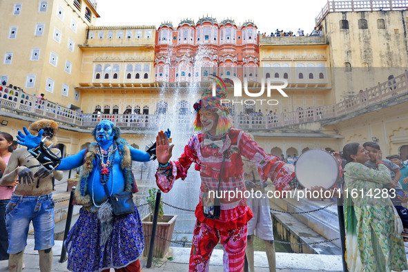 Artists perform during the World Tourism Day celebration at the historical Hawa Mahal in Jaipur, Rajasthan, India, on September 27, 2024. 