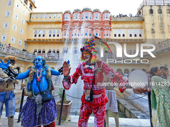 Artists perform during the World Tourism Day celebration at the historical Hawa Mahal in Jaipur, Rajasthan, India, on September 27, 2024. (