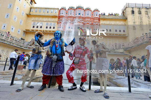 Artists perform during the World Tourism Day celebration at the historical Hawa Mahal in Jaipur, Rajasthan, India, on September 27, 2024. 