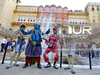 Artists perform during the World Tourism Day celebration at the historical Hawa Mahal in Jaipur, Rajasthan, India, on September 27, 2024. (