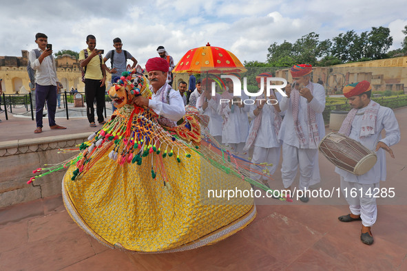 Rajasthani folk artists perform during the World Tourism Day celebration at the historical Jantar Mantar in Jaipur, Rajasthan, India, on Sep...