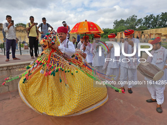 Rajasthani folk artists perform during the World Tourism Day celebration at the historical Jantar Mantar in Jaipur, Rajasthan, India, on Sep...