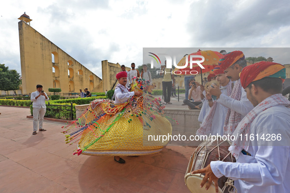 Rajasthani folk artists perform during the World Tourism Day celebration at the historical Jantar Mantar in Jaipur, Rajasthan, India, on Sep...