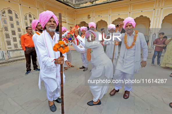 Rajasthani folk artists perform during the World Tourism Day celebration at the historical Hawa Mahal in Jaipur, Rajasthan, India, on Septem...