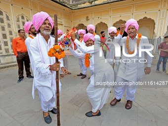 Rajasthani folk artists perform during the World Tourism Day celebration at the historical Hawa Mahal in Jaipur, Rajasthan, India, on Septem...