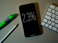 Interest rate percentage is seen on a phone screen in this illustration photo taken in Warsaw, Poland on 27 September, 2024. (