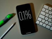 Interest rate percentage is seen on a phone screen in this illustration photo taken in Warsaw, Poland on 27 September, 2024. (