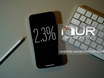 Interest rate percentage is seen on a phone screen in this illustration photo taken in Warsaw, Poland on 27 September, 2024. (