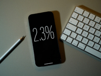 Interest rate percentage is seen on a phone screen in this illustration photo taken in Warsaw, Poland on 27 September, 2024. (