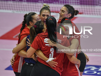 Olympiacos Athens celebrates scoring during the team's International Trophy ''Una squadra per un sorriso'' match between Reale Mutua Fenera...